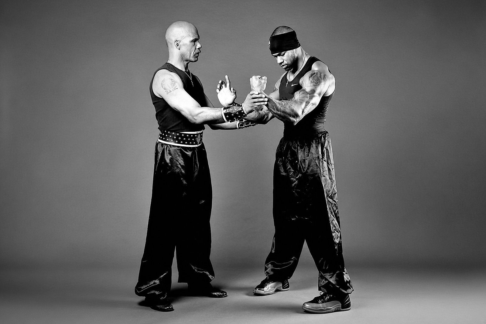 Black and white photo of Sifu Mike Marshall working a wrist drill with the author